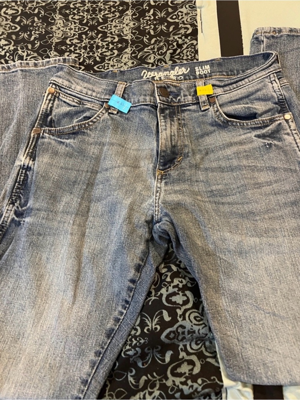 Two pairs of Wrangler Men’s Slim Bootcut Jeans 30x32 Light Blue and Washed grey